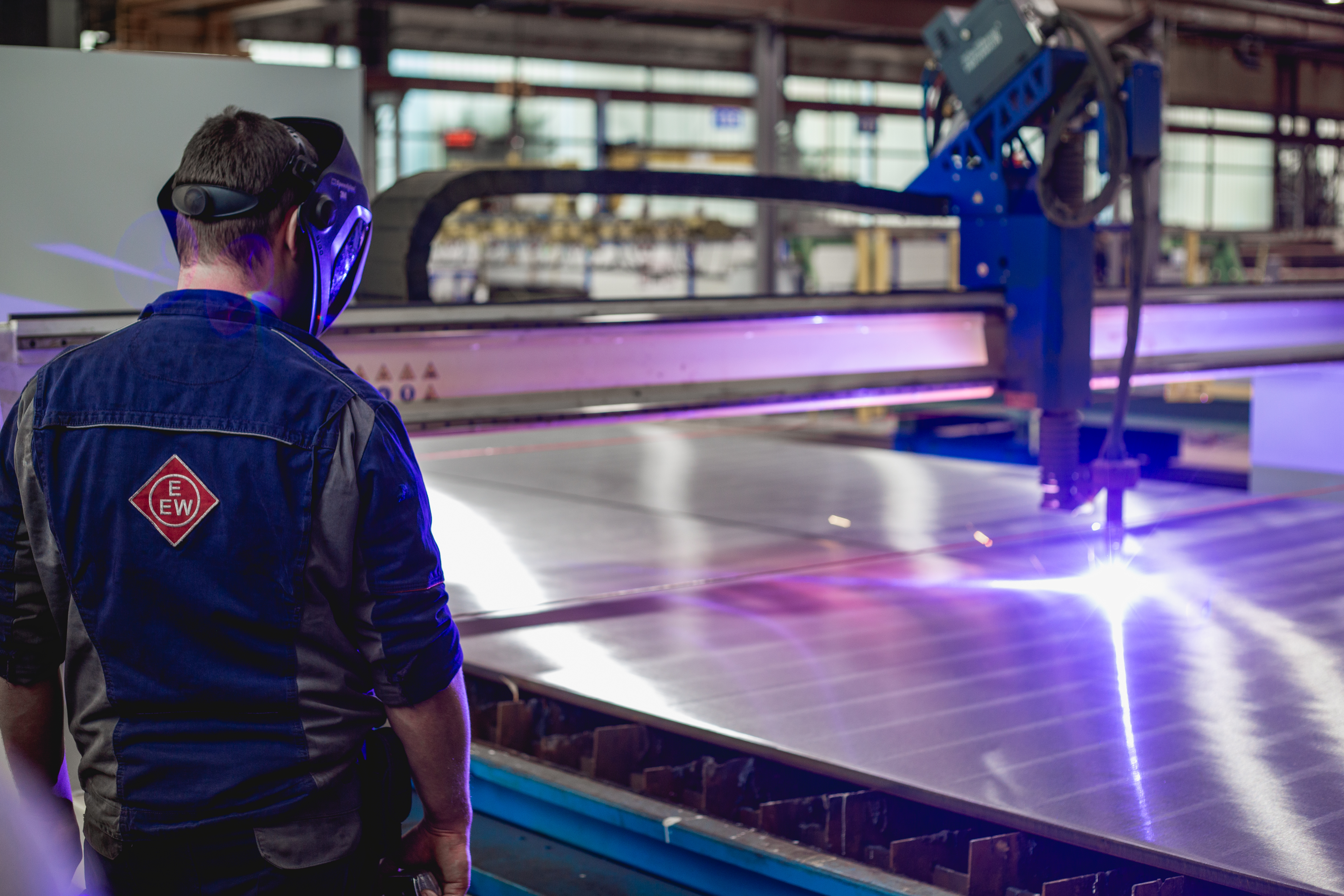 Operator operating the CNC Sapphire machine during plasma cutting